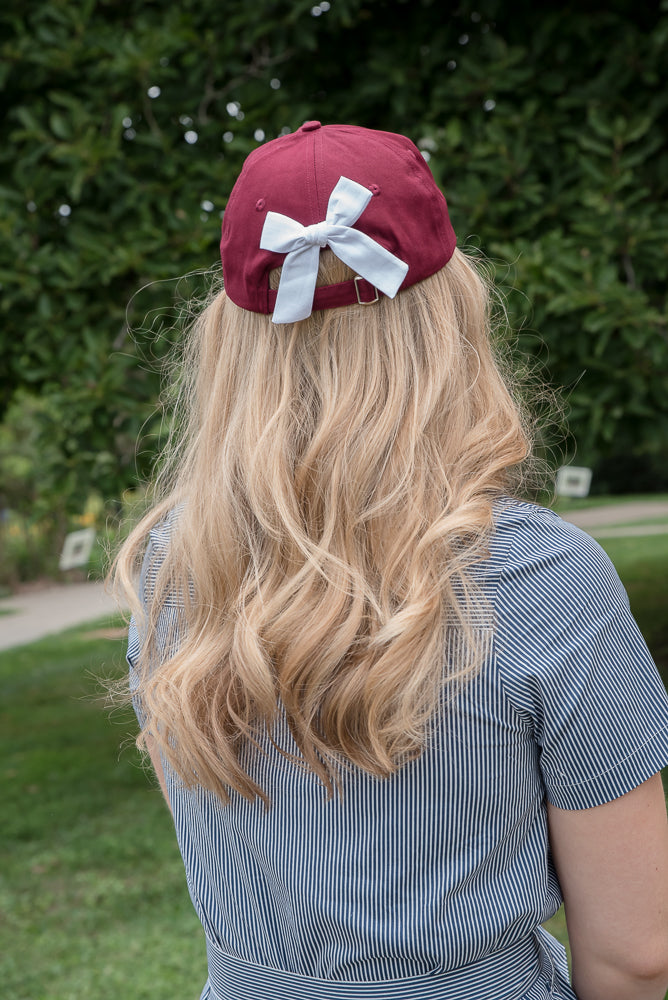 Customizable Bow Baseball Hat in Gracie Garnet (Women)