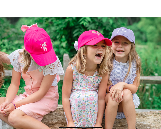 girls wearing bow baseball hats and sun hats for girls